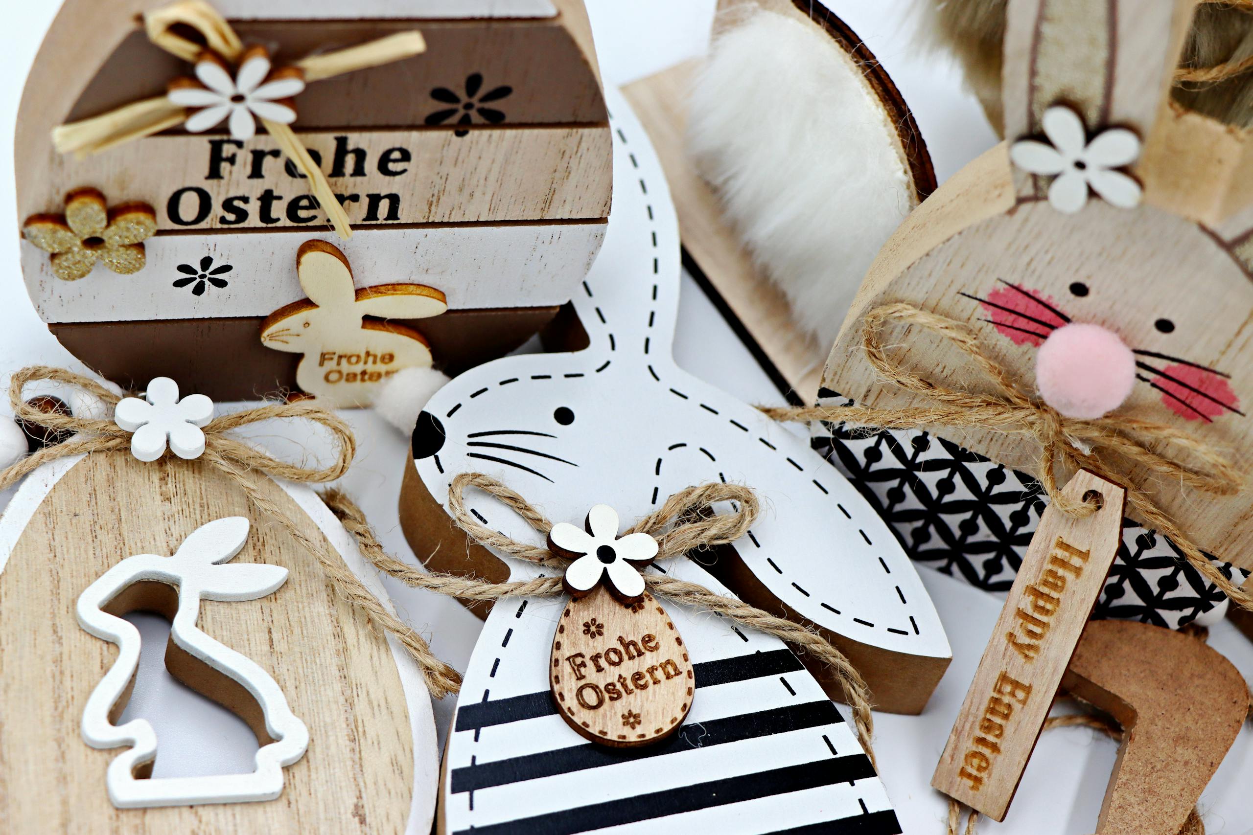 Rustic wooden Easter decor featuring bunnies, eggs, and floral elements for festive crafts.